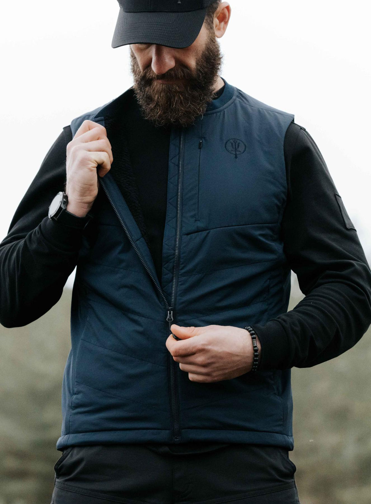 An in the field image of Men's Wraith Gilet in Dark Sapphire (ITF)